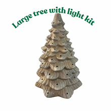 Load image into Gallery viewer, A decorated Christmas tree with lights and take-home craft kits sign text placed in front.
