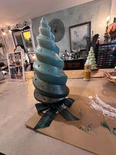 Load image into Gallery viewer, Blue spiral decorative item on a table with a room setting in the background