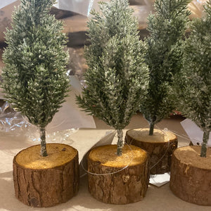 6 x 6 flocked evergreen tree in rustic wood stand. Perfect for holiday decorating.   Dimensions:2.50" Diameter x 6.50" Material:Plastic, Wire, Wood, Mica Sold At Miller's Crossing Design, Baldwinsville, NY